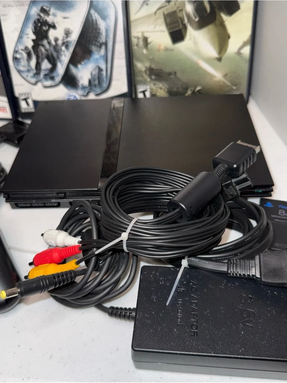Sony PlayStation 2 Slim Console Bundle in Black with games and Controllers